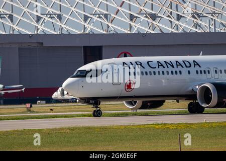 Montreal, Quebec, Canada - 07 06 2021: Air Canada Boeing 737 Max8 landing in Montreal. Registration C-FSDB. Stock Photo