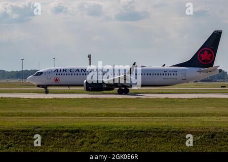 Montreal, Quebec, Canada - 07 06 2021: Air Canada Boeing 737 Max8 landing in Montreal. Registration C-FSDB. Stock Photo
