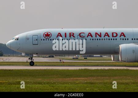 Montreal, Quebec, Canada - 07 06 2021: Air Canada boeing B777-300 taxiing after landing in Montreal. Stock Photo