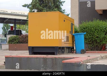 Emergency electric power generator box and garbage bin Stock Photo