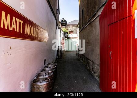 Beer kegs stacked in the laneway beside Matt Molloy's pub in Westport, County Mayo, Ireland. Stock Photo