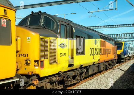 Colas Rail Freight English Electric Type 3 class 37 No 37421 Locomotive in siding at Blackpool North Station Lancashire England UK Stock Photo