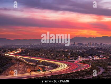 Phoenix, Arizona freeway leading toward downtown at sunset Stock Photo