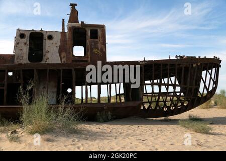 Boats in desert around Moynaq, Muynak or Moynoq - Aral sea or Aral lake - Uzbekistan - asia Stock Photo