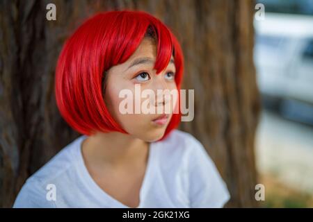 Red Blood Cell Cosplay Actress Standing with Redwood Tree | Teen Asian Girl with Red Wig