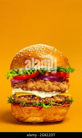 Big doubleburger with breaded chicken cutlet Stock Photo