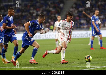Bruno GUIMARAES of Lyon and Frederic GUILBERT of Strasbourg during the French championship Ligue 1 football match between Olympique lyonnais and Racing Club de Strasbourg Alsace on September 12, 2021 at Groupama Stadium in Décines-Charpieu, near Lyon, France - Photo Romain Biard / DPPI Stock Photo