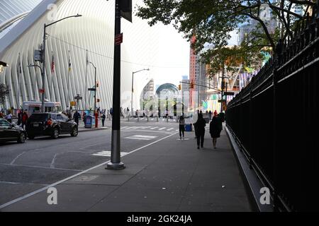 Pedestrians make their way along Fulton Street next to St. Paul’s