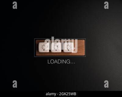 Loading..., the word with light bulb icon on white dices and wood cube block in the progress bar on dark background. Update and upgrade Ideas, creativ Stock Photo