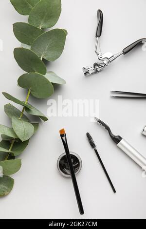 Henna, tools for eyebrows and eyelashes correction on light background Stock Photo