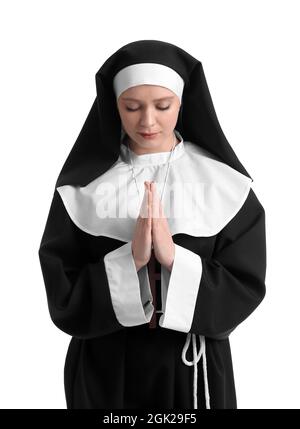 Young praying nun on white background Stock Photo