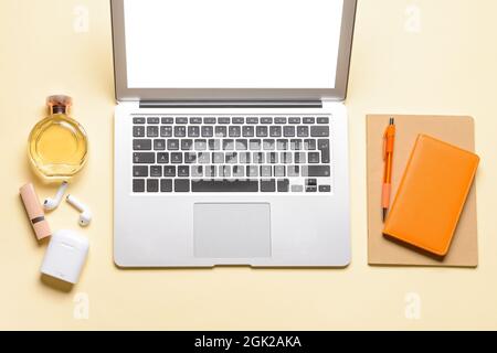 Laptop, notebooks and different accessories on color background Stock Photo