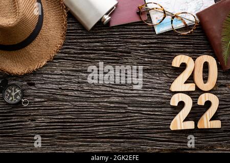 top view 2020 happy new year number on wood table with adventure accessory item,holiday vacation planning Stock Photo