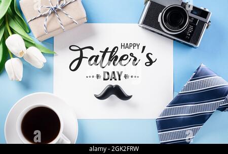 Happy Father's Day decoration concept with greeting card on pastel blue background. Stock Photo