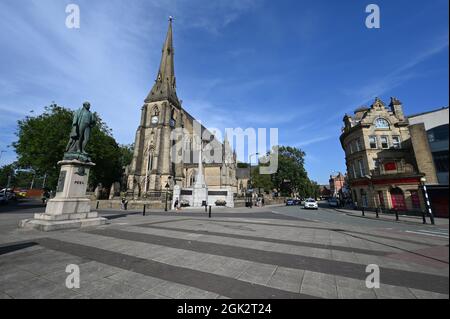 Church, statue and war memorial in Bury town center Stock Photo