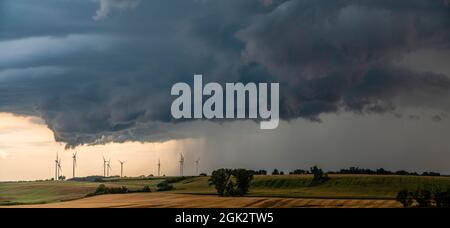 ThunderStorm over fields, a huge storm cloud that causes heavy rainfall Stock Photo