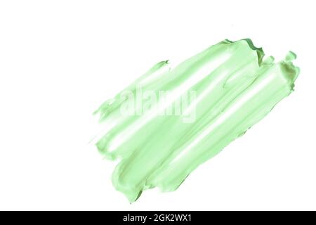 The smear and texture of the cream.Pistachio color, isolated on a white background. An element for cosmetic beauty design. High quality photo Stock Photo