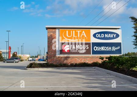 Humble, Texas USA 08-22-2019: Store signs on a wall board in an Humble, Texas shopping center. Stock Photo