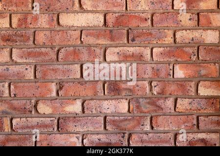 Close up of wall made of red bricks with black inclusions background bricks with texture Stock Photo