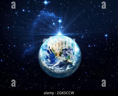 Planet Earth in starry space. Dark blue night sky with bright stars. Christmas Star of Bethlehem Nativity, christmas of Jesus Christ. Elements of this Stock Photo