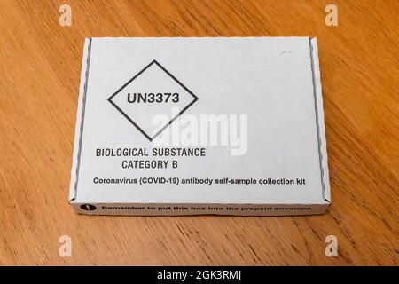 An external view of a government provided Covd-19 antibody self sample  collection kit. The sample is then posted to a lab to be processed. Stock Photo