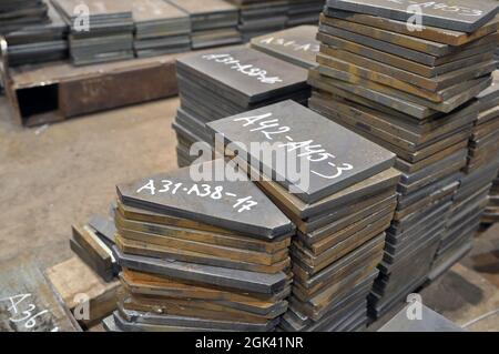 Metal cutting. Warehousing of finished parts with marking. Stock Photo