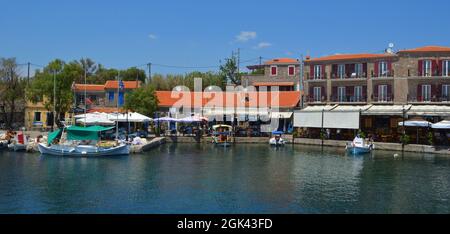 Pretty harbour at Molyvos  on the island of Lesvos  with fishing boats and restaurants. Stock Photo