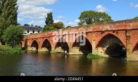 Great Barford Packhorse Bridge and pub Bedfordshire England. Stock Photo
