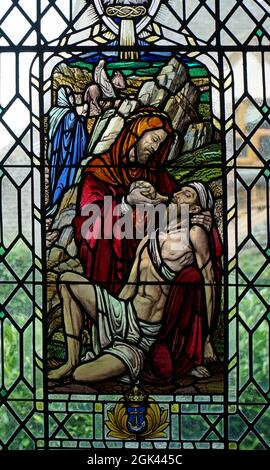 Stained Glass Window Depicting the Good Samaritan in Roxton Chapel. Stock Photo