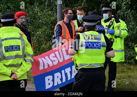 Insulate Britain Climate Activists protesters block A41 M25 J20 roundabout in Hertfordshire between Watford and Kings Langley with police on scene Stock Photo