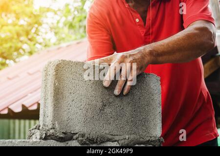 bricklayer man working build for construction at home Stock Photo
