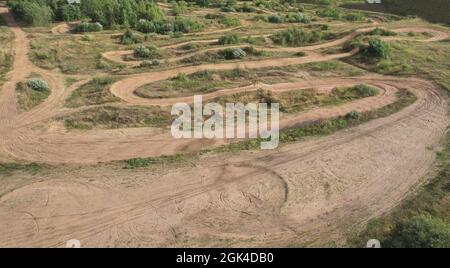 Cross-country track road for motocross. Dirty sand race lane Stock Photo