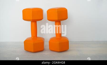 orange dumbells Stock Photo