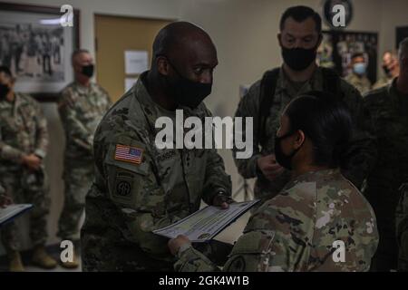 Maj. Gen. Xavier T. Brunson, the I Corps commanding general, presents a