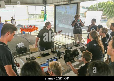 A pre-event pep talk: Massachusetts Institute of Technology, Lincoln Laboratory program advisor Dr. Sarah Willis addresses Ebeye and Kwajalein high school student participants in the Beaver Works Summer Institute - Autonomous RACECAR Grand Prix finale at the Jabro Sports Complex on Ebeye Aug. 2, 2021. The students showcased their talents after completing the multi-week intensive summer program. Stock Photo