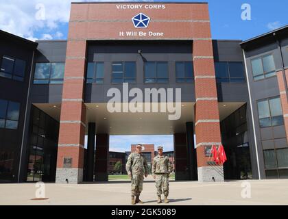 U.S. Army Gen. Christopher Cavoli, (right), United States Army Europe and Africa commanding general, and Lt. Gen. John Kolasheski, V Corps commanding general, close out the day after a walkthrough of the V Corps headquarters, on Fort Knox, Kentucky, Aug. 3, 2021. The two general officers talked about the future of V Corps as it continues on the training path to reach full operational capability later this year. Stock Photo