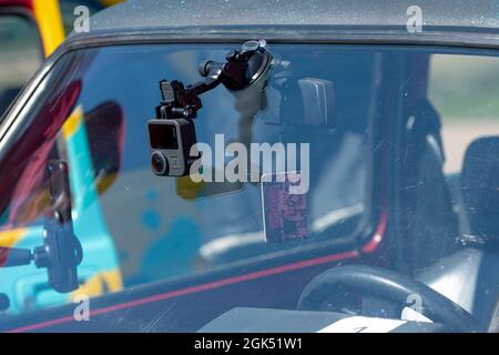 Riga, Latvia - May 01, 2021: action camera GoPro Max for video recording mouonted on the car front window Stock Photo