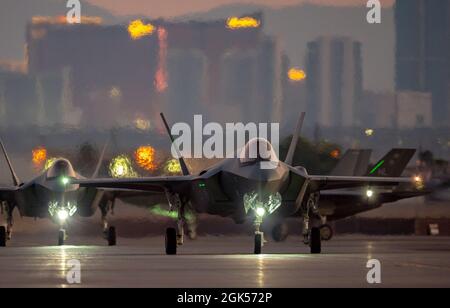 F-35A Lightning II fighter jets, assigned to the 421st Fighter Squadron, Hill Air Force Base, Utah, prepare to take-off for a Red Flag-Nellis 21-3 mission at Nellis Air Force Base, Nevada, Aug. 4, 2021. Red Flag takes place over the Nevada Test and Training Range, which has the largest contiguous ground space available for military operations, and is home to the most advance aerial test and training environment. Stock Photo