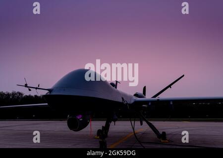 A U.S. Air Force MQ-9 Reaper from the Arizona Air National Guard 214th Attack Group parked on the flightline at the Alpena Combat Readiness Training Center, Mich. as its crew prepares to participate in the Northern Strike exercise on August 5, 2021. Northern Strike is a National Guard Bureau-sponsored exercise that is a tailored readiness producer that has brought together 5,100 participants from various states and countries at the National All-Domain Warfighting Center. Stock Photo