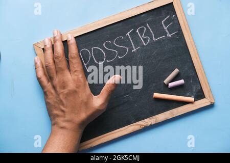 young man hand over impossible text . Stock Photo