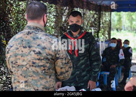 Royal Thai Army Corporal Arnon Lolaem, a corpsman from Royal Thai Army Border Patrol Task Force 2, participates in emergency field medical training led by U.S. Navy Petty Officer 2nd Class Joseph Campana during Exercise Cobra Gold 21 at Ta Mor Roi training area in Surin Province, Thailand, August 8, 2021. Royal Thai and American Armed Forces worked together during the exercise to conduct landmine disposal operations, render-safe procedure training, and partnered medical response trauma training. This exercise is aligned with the U.S. Department of Defense’s Humanitarian Mine Action Program, wh Stock Photo