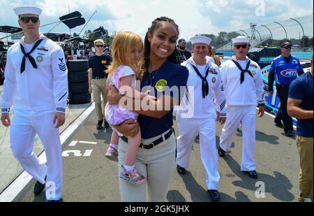 210808-N-RB168-0205 WATKINS GLEN, N.Y. (August 8, 2021) — Recruiters from Navy Talent Acquisition Group (NTAG) Pittsburgh escort future Sailors are onto the race track at the Go Bowling at the Watkins Glen NASCAR Cup Series race. More than 28 future Sailors took the oath of enlistment at the event. Cmdr. Brandon Smith, commanding officer of NTAG Pittsburgh administered the oath. NTAG Pittsburgh, part of Navy Recruiting Command, recruits the next generation of Navy Sailors throughout areas in Pennsylvania, New York, West Virginia, and Maryland. Stock Photo