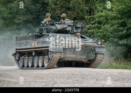 British army Warrior FV510 light infantry fighting vehicle tank in action on a military exercise, Salisbury Plain, Wiltshire UK Stock Photo