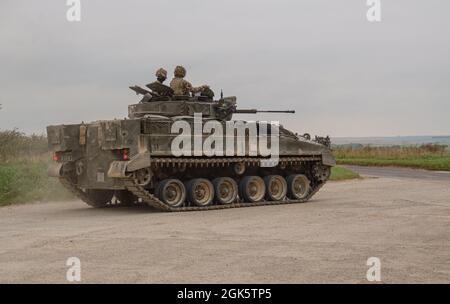 British army Warrior FV510 light infantry fighting vehicle tank in action on a military exercise, Salisbury Plain, Wiltshire UK Stock Photo