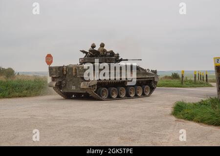 British army Warrior FV510 light infantry fighting vehicle tank in action on a military exercise, Salisbury Plain, Wiltshire UK Stock Photo