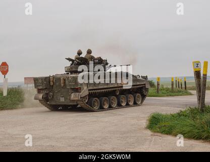 British army Warrior FV510 light infantry fighting vehicle tank in action on a military exercise, Salisbury Plain, Wiltshire UK Stock Photo