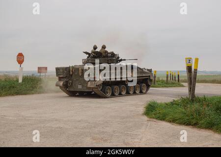 British army Warrior FV510 light infantry fighting vehicle tank in action on a military exercise, Salisbury Plain, Wiltshire UK Stock Photo