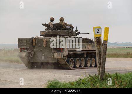 British army Warrior FV510 light infantry fighting vehicle tank in action on a military exercise, Salisbury Plain, Wiltshire UK Stock Photo