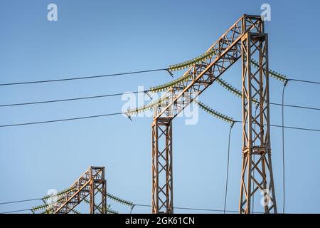 Electricity distribution station. Electrical pylon and high voltage power lines. Stock Photo