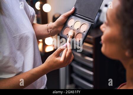 Close up of stylist using professional cosmetics Stock Photo